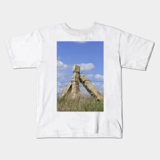 Kansas Limestone Corner Post with Prairie grass and blue sky and white cloud's. Kids T-Shirt